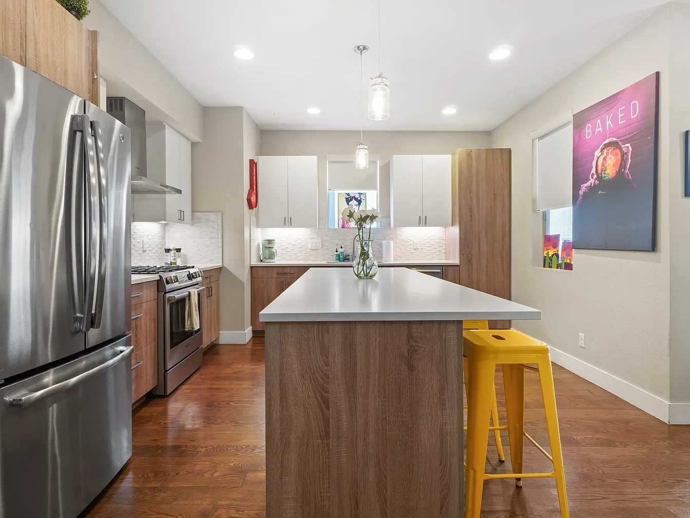 Kitchen with island and stainless appliances